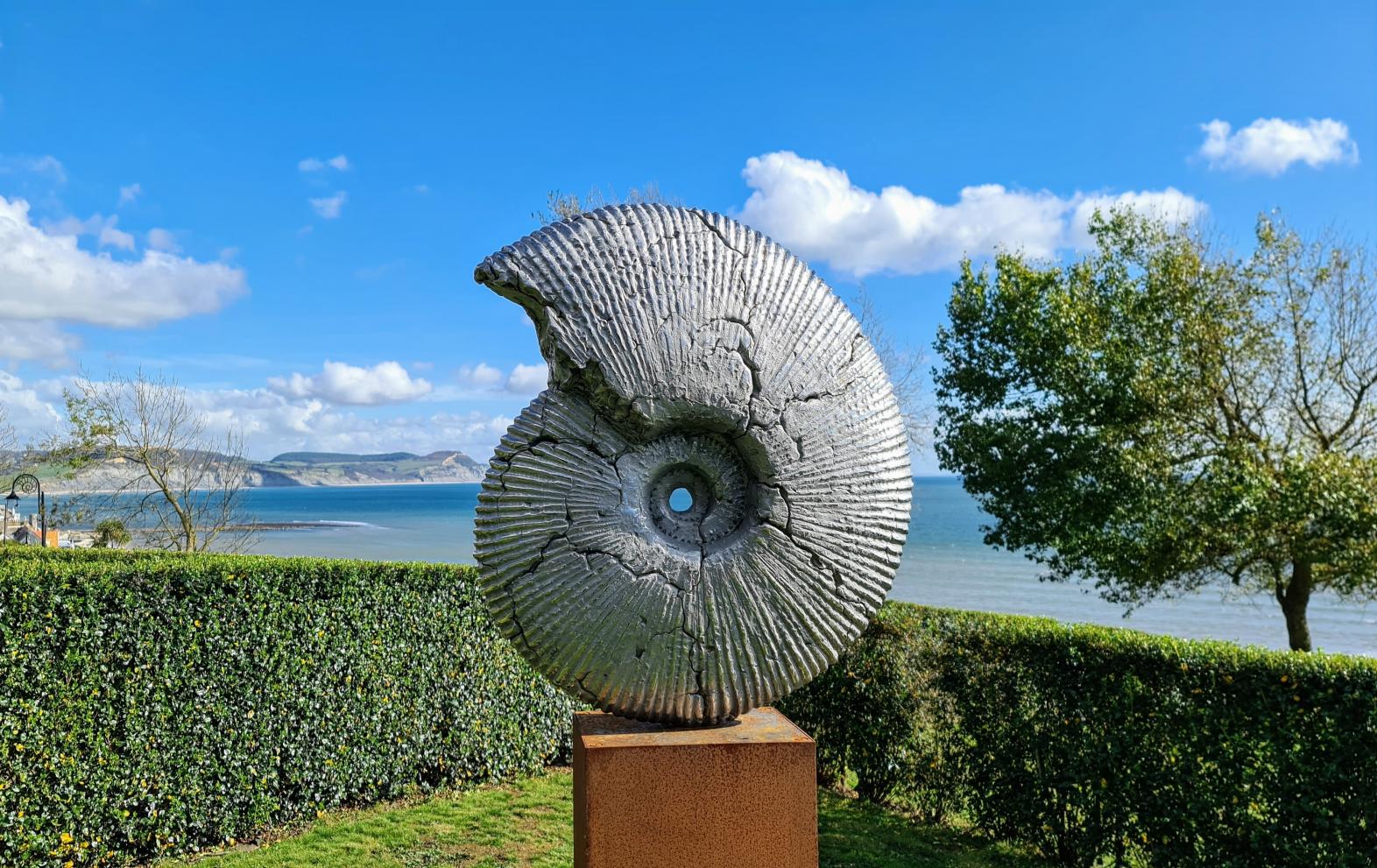 Ammonite Jurassic Cracked by Hamish Mackie, part of the Sculpture Trail in Langmoor Gardens, Lyme Regis
