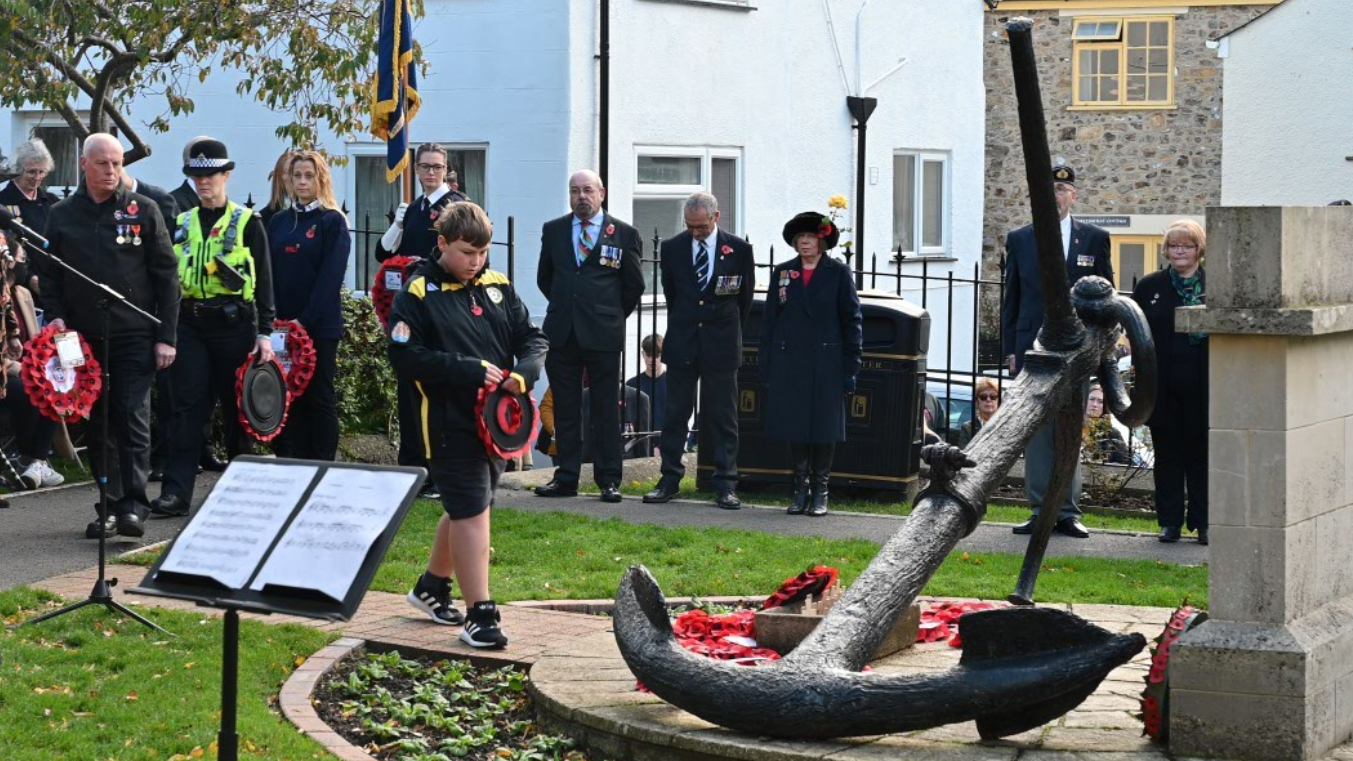 Jacob Denning lays a wreath on behalf of Lyme Regis Youth Football