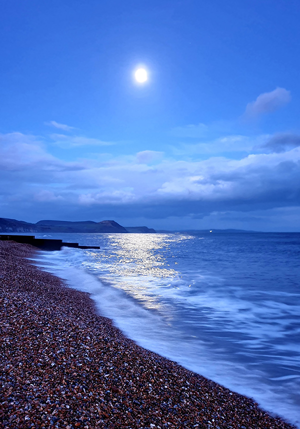Moonlight reflecting on the water in Lyme Regis