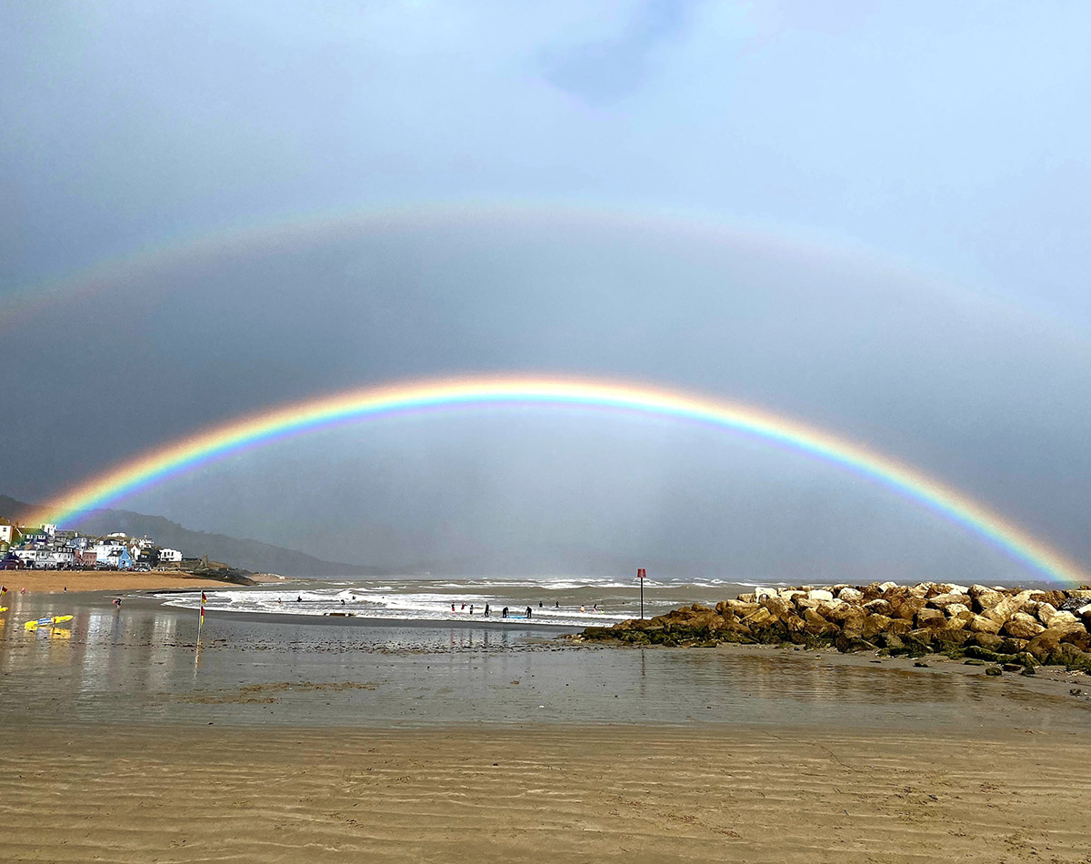 Stunning double rainbow Lyme Regis Sandy beach  