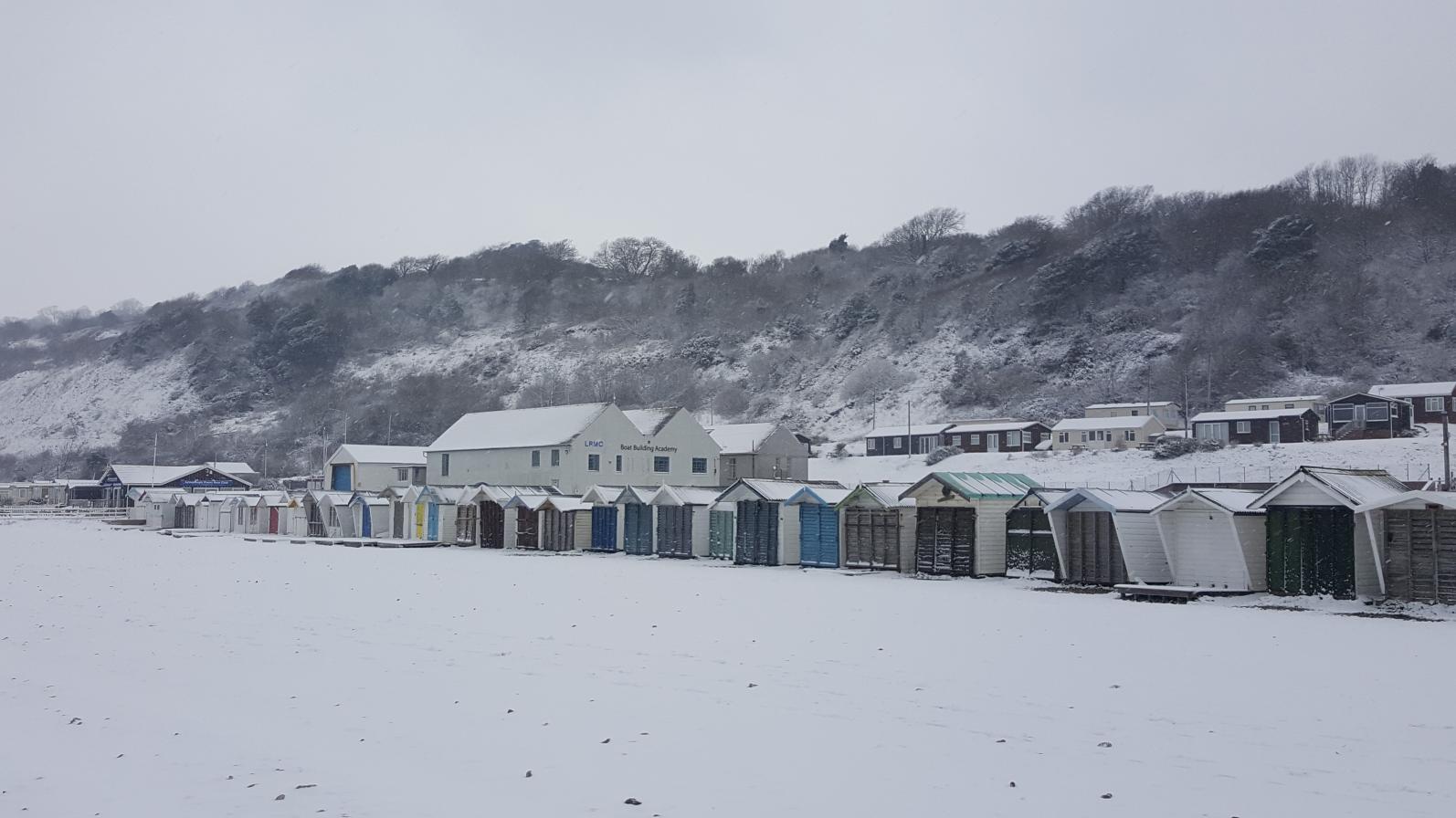 Snow, beach huts Monmouth beach 2018