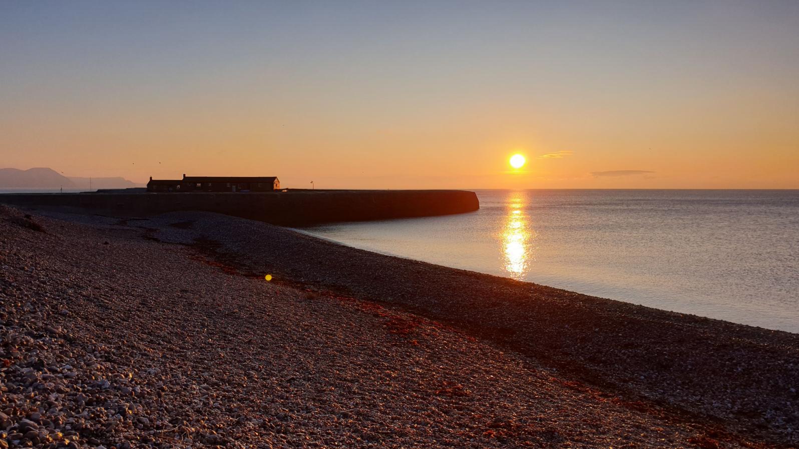 Sunrise from Monmouth beach Lyme Regis