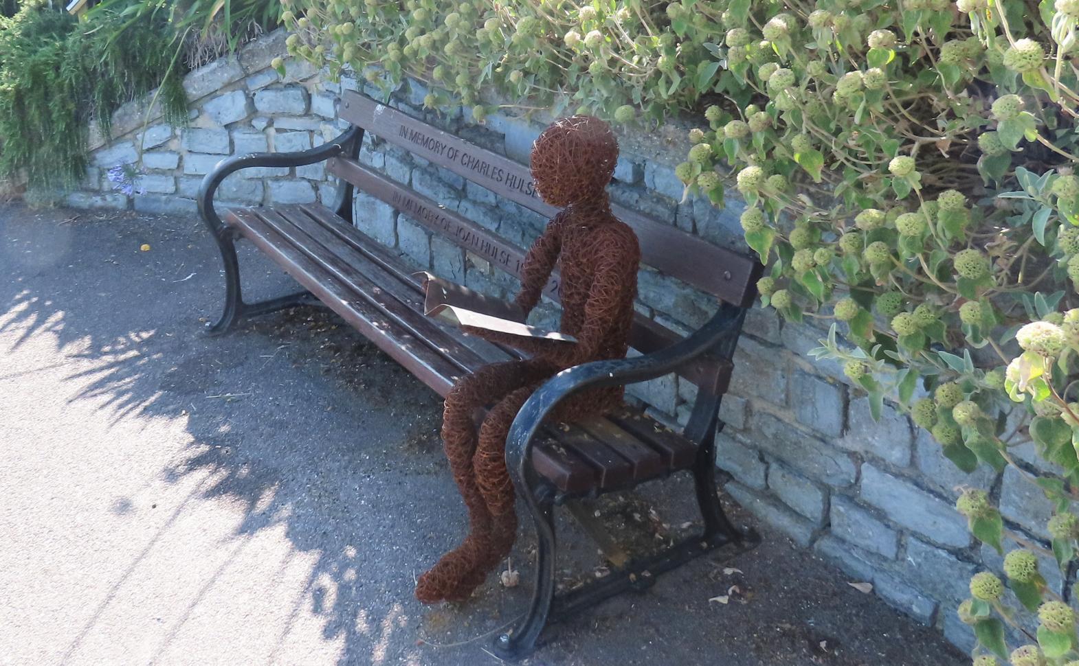 The Reader by Victoria Westaway, part of the Sculpture Trail in Langmoor Gardens, Lyme Regis